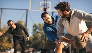 Group of men playing basketball