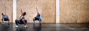 Group fitness class squatting